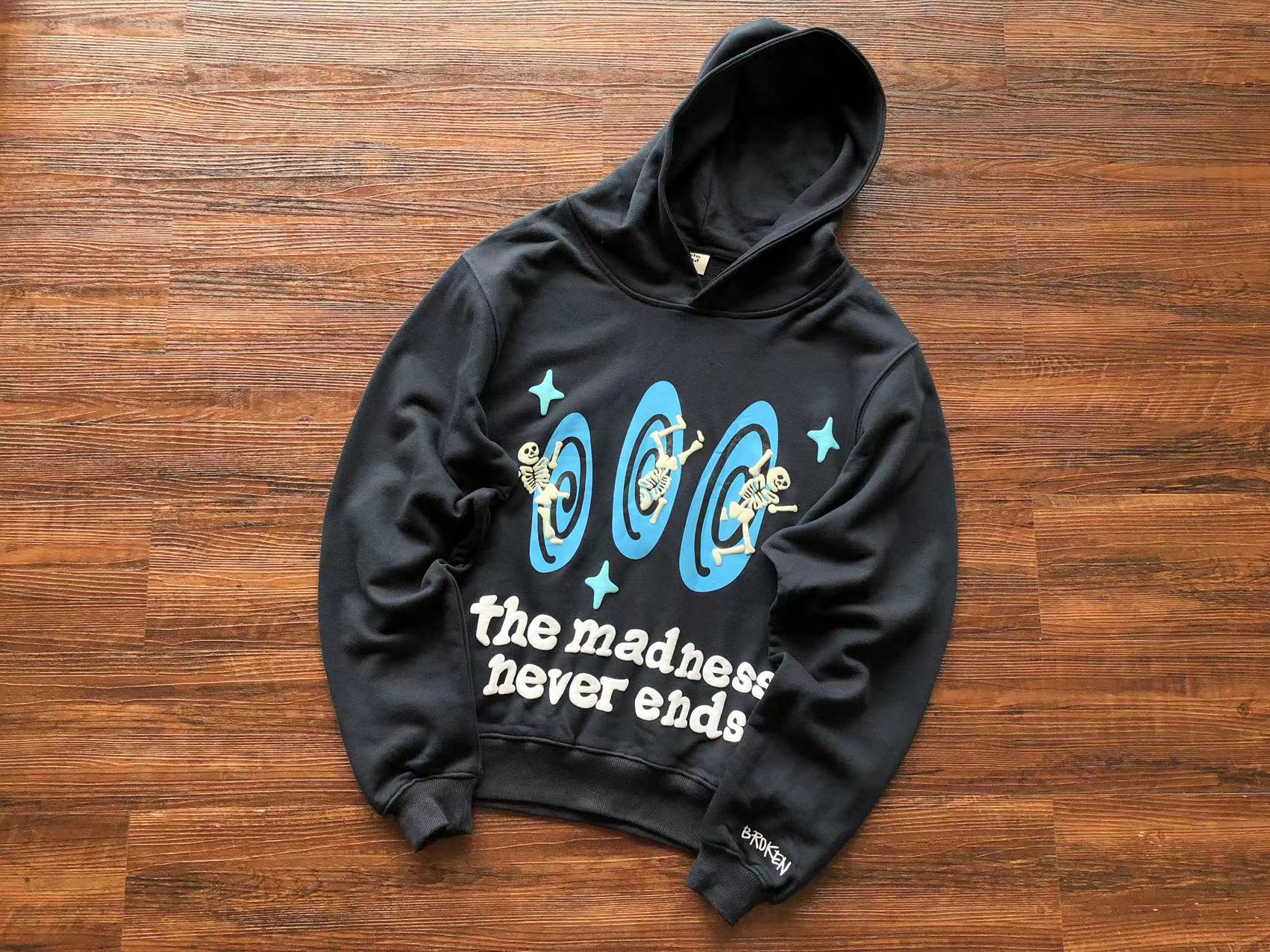 Broken Planet Hoodie "the madness never ends"