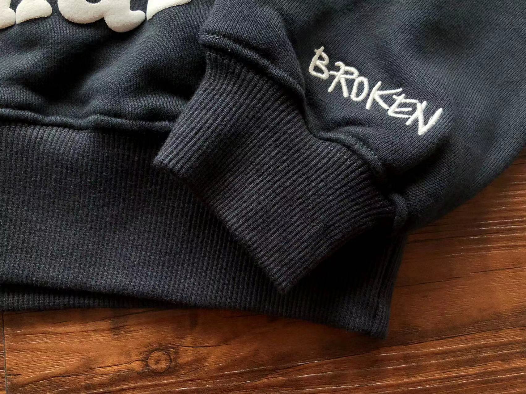 Broken Planet Hoodie "the madness never ends"